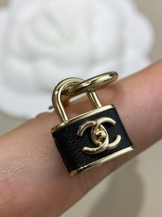 CHANEL Marcelline Lock Charm Stud Earrings